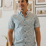 Light blue button up shirt with wave print and hidden side zipper pocket