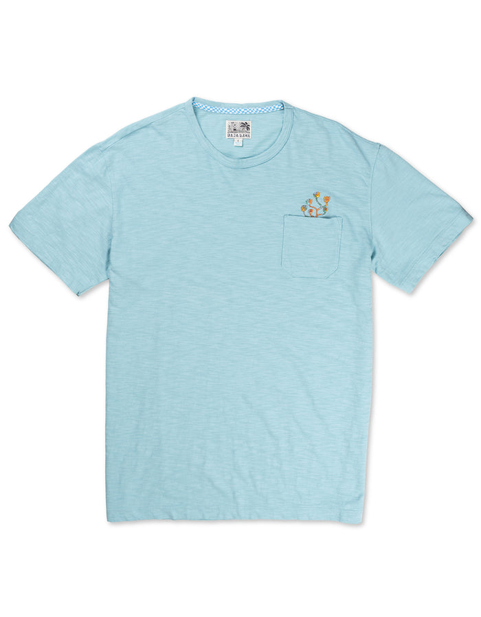 Front flat-lay view of the Baja Llama El Sativo Cacti Pima Slub Pocket Tee, featuring a light porcelain blue crewneck t-shirt with a left chest pocket topped with a small embroidered orange and green cactus graphic.