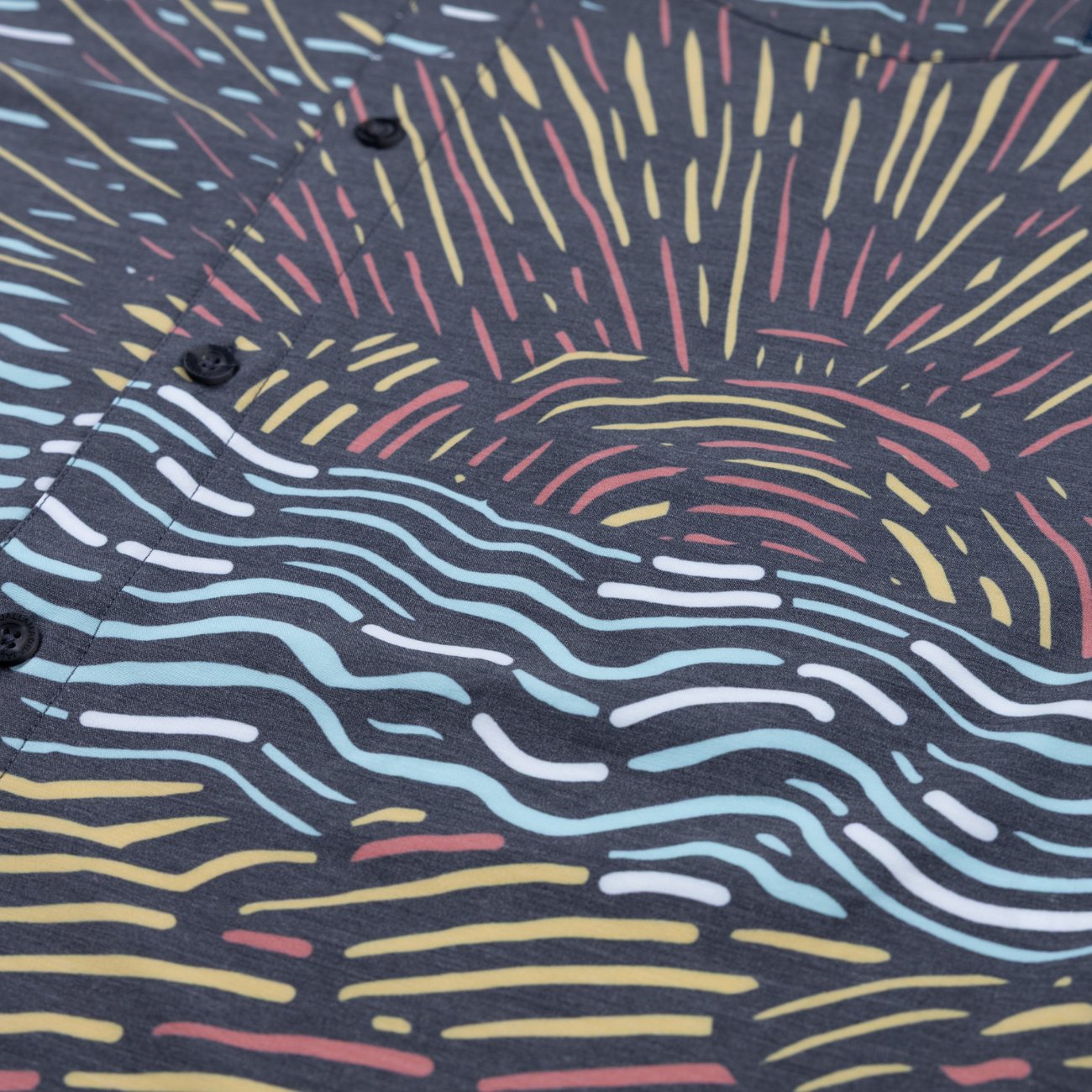 Baja Llama Graphic button-up with vibrant sunset line art across the chest. Stylish and modern resort wear.