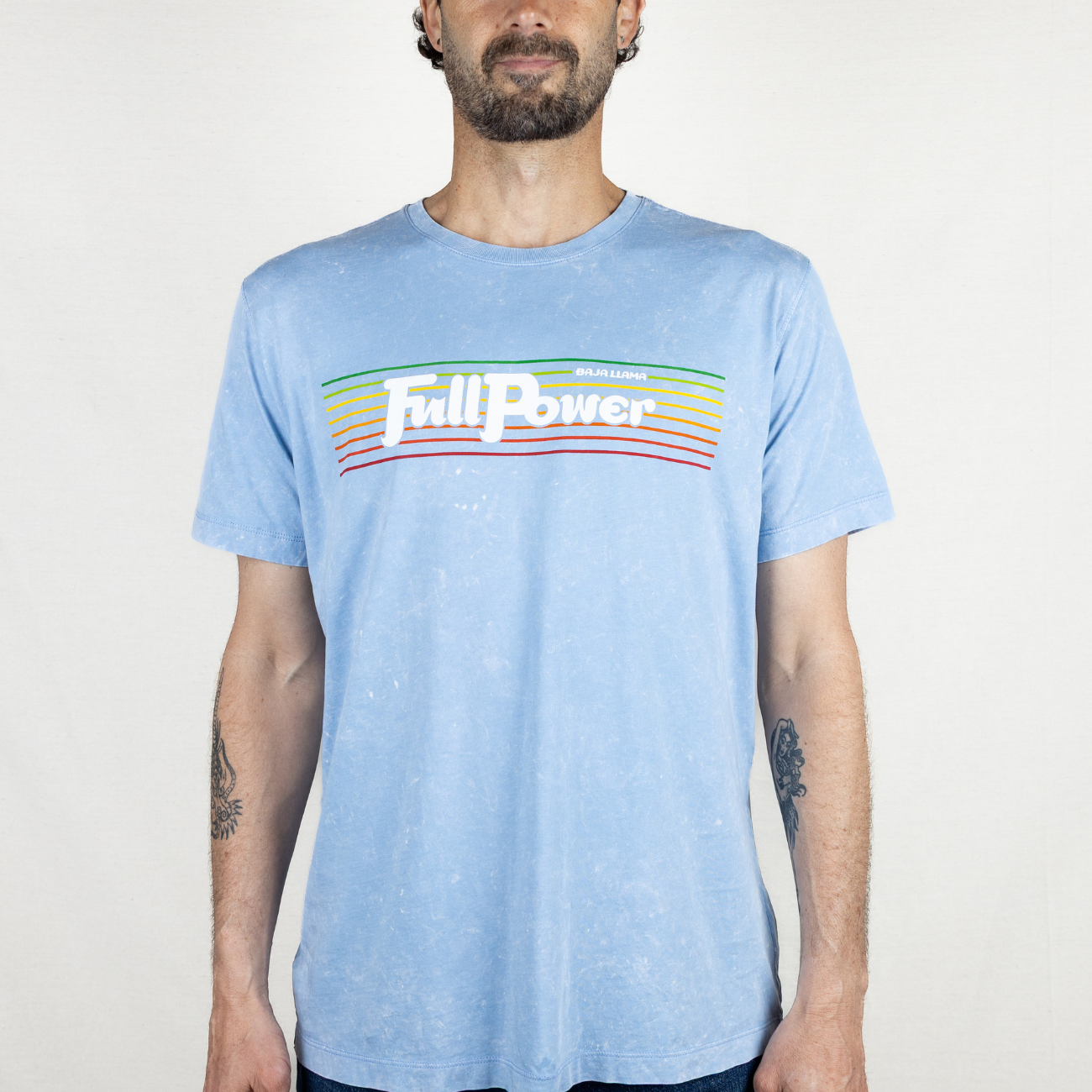 Baja Llama light blue tee with “Full Power” rainbow stripe graphic. Vintage-washed and effortlessly bold.
