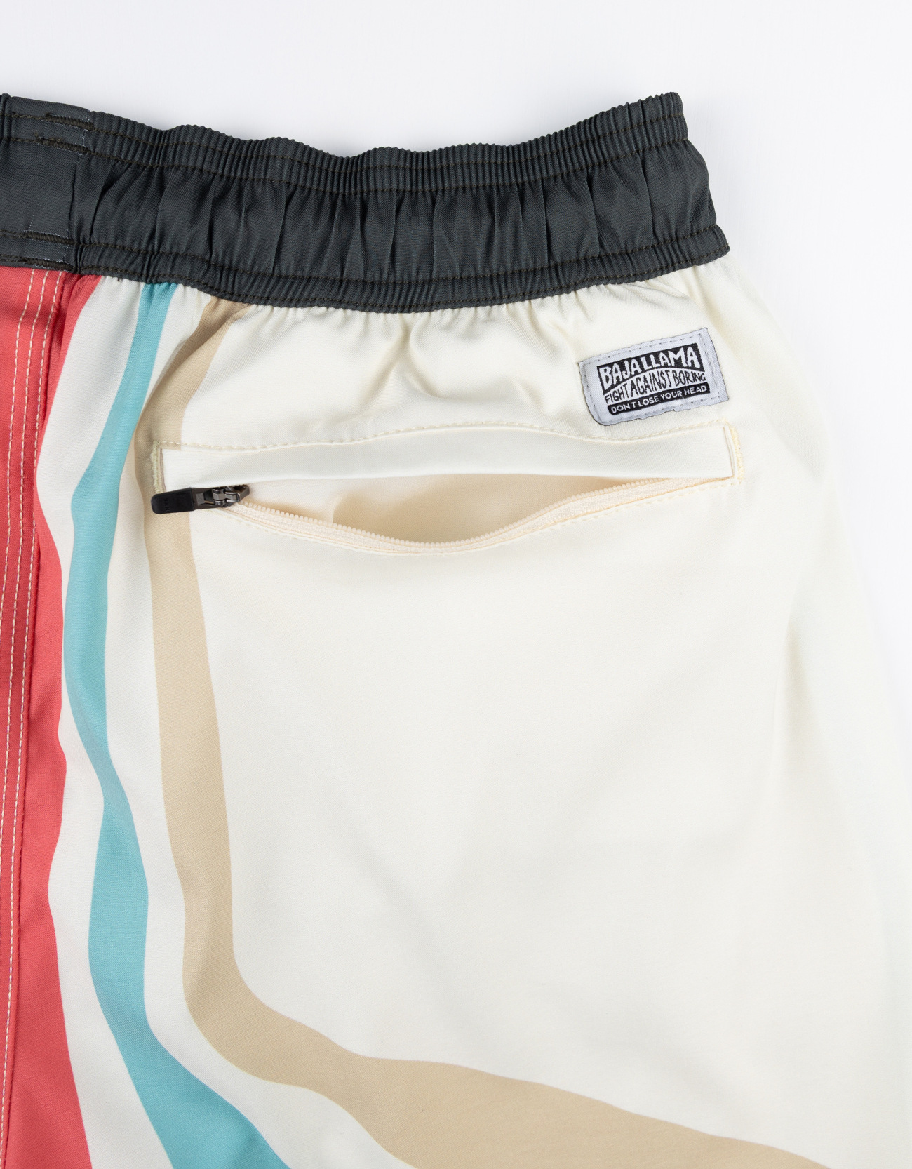 Retro-inspired swim shorts with bold, colorful stripes and a black waistband. Quick-dry fabric and a relaxed fit for ultimate comfort.