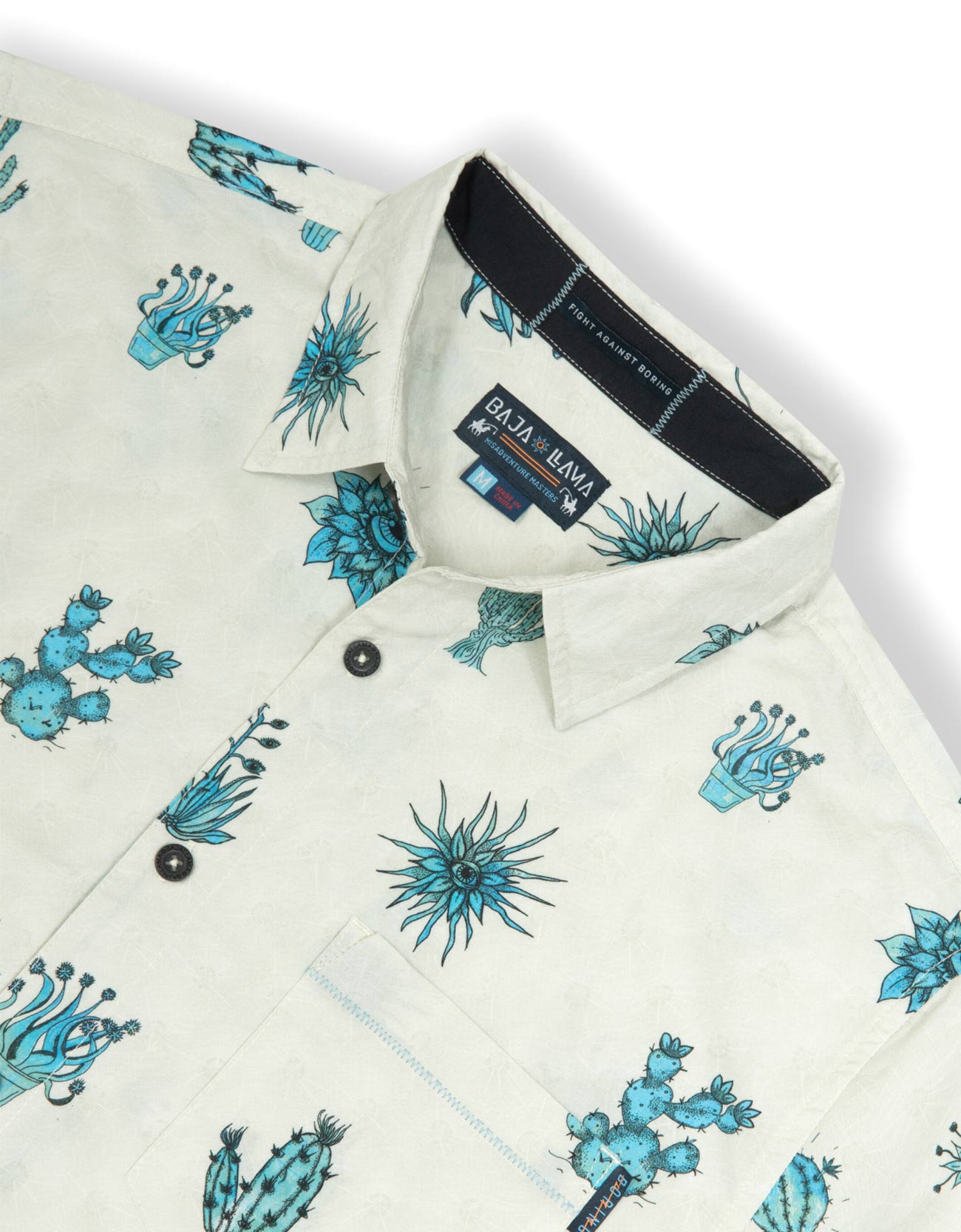 Tan button up shirt with various cactus print in turquoise