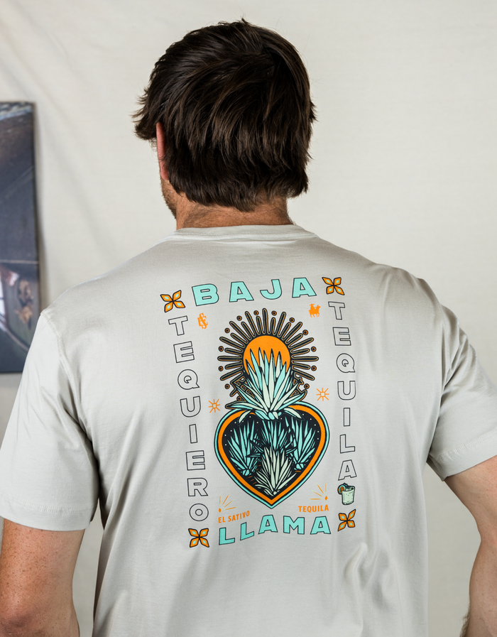 Back studio view of cream Agave El Sativo tee with Te Quiero Tequila agave heart back print