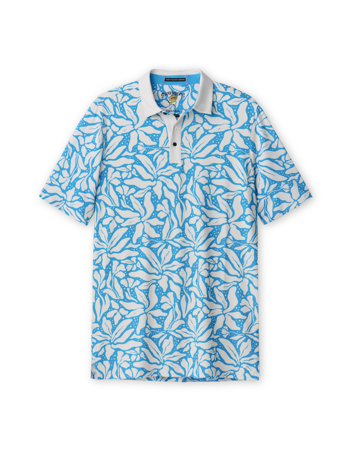Front flat-lay view of the Baja Llama Leaf Me Blue Swingers Performance Polo, featuring an all-over vibrant blue and white tropical leaf pattern with a solid white collar and button placket.