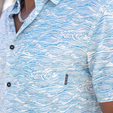 Light blue button up shirt with wave print and hidden side zipper pocket