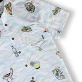 Button up shirt with hand-drawn illustrations of Peruvian ceviche, flutes, llamas, pisco