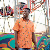 Button up shirt with hand painted watercolor cactus design on orange background.