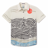 Flat lay of Red Sun Over Black Hills Vagabond recycled travel button-up shirt with bold print