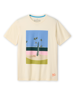 Full view of the Baja Llama 5PM Primo graphic tee featuring a desert cactus and palm tree landscape print on a cream-colored shirt.