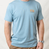 Bus Experience graphic tee by Baja Llama. Light teal tee with a retro bus design. Soft fabric and relaxed fit, perfect for laid-back, adventurous style.