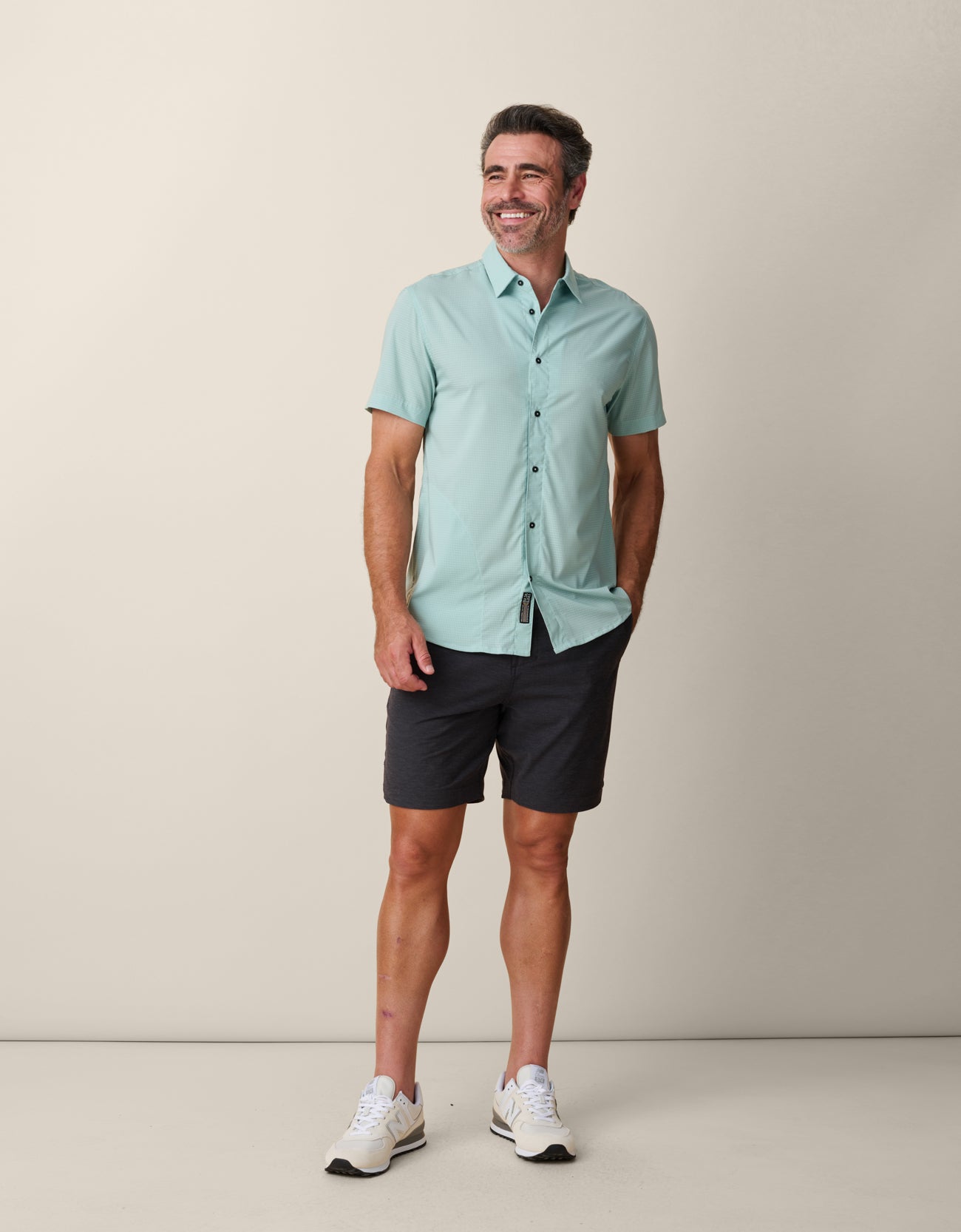 Lightweight travel shirt in sage green with tailored fit