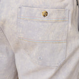 Close-up of acid wash gray shrots with a pocket and button detail.