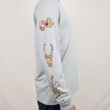Baja Llama light desert-themed long sleeve tee with snake and Joshua tree back graphic. Soft cotton with printed sleeve details.