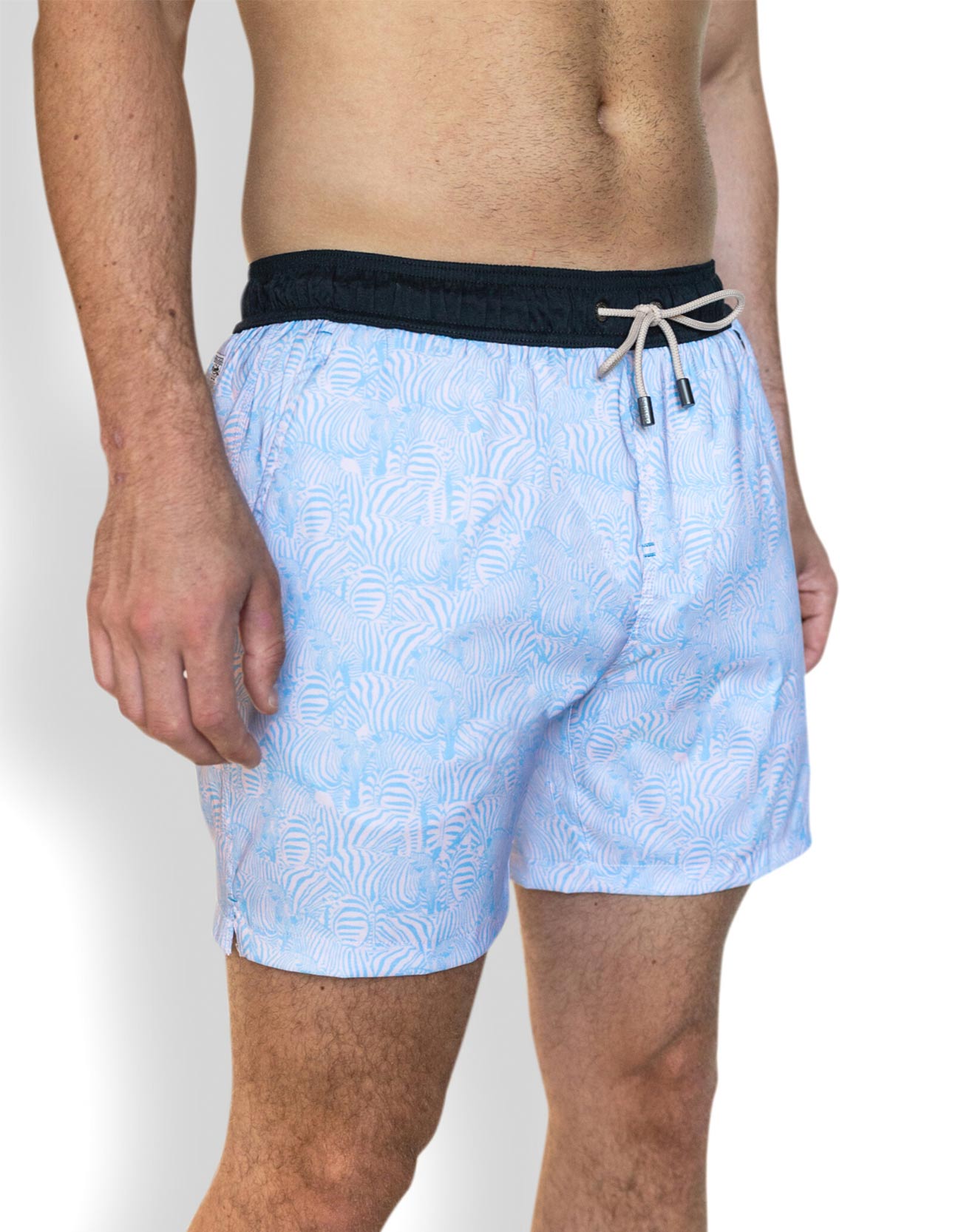 Light blue men's stretched swimsuit  featuring striped zebra prints with zippered side pockets.