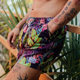 Purple mens volley shorts with assorted tropical leaves print like monstera, taro, palm, etc. 