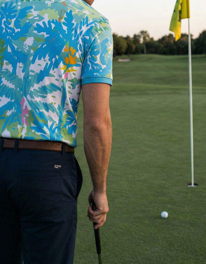 Man wearing Blue Paradise tropical golf shirt polo playing golf