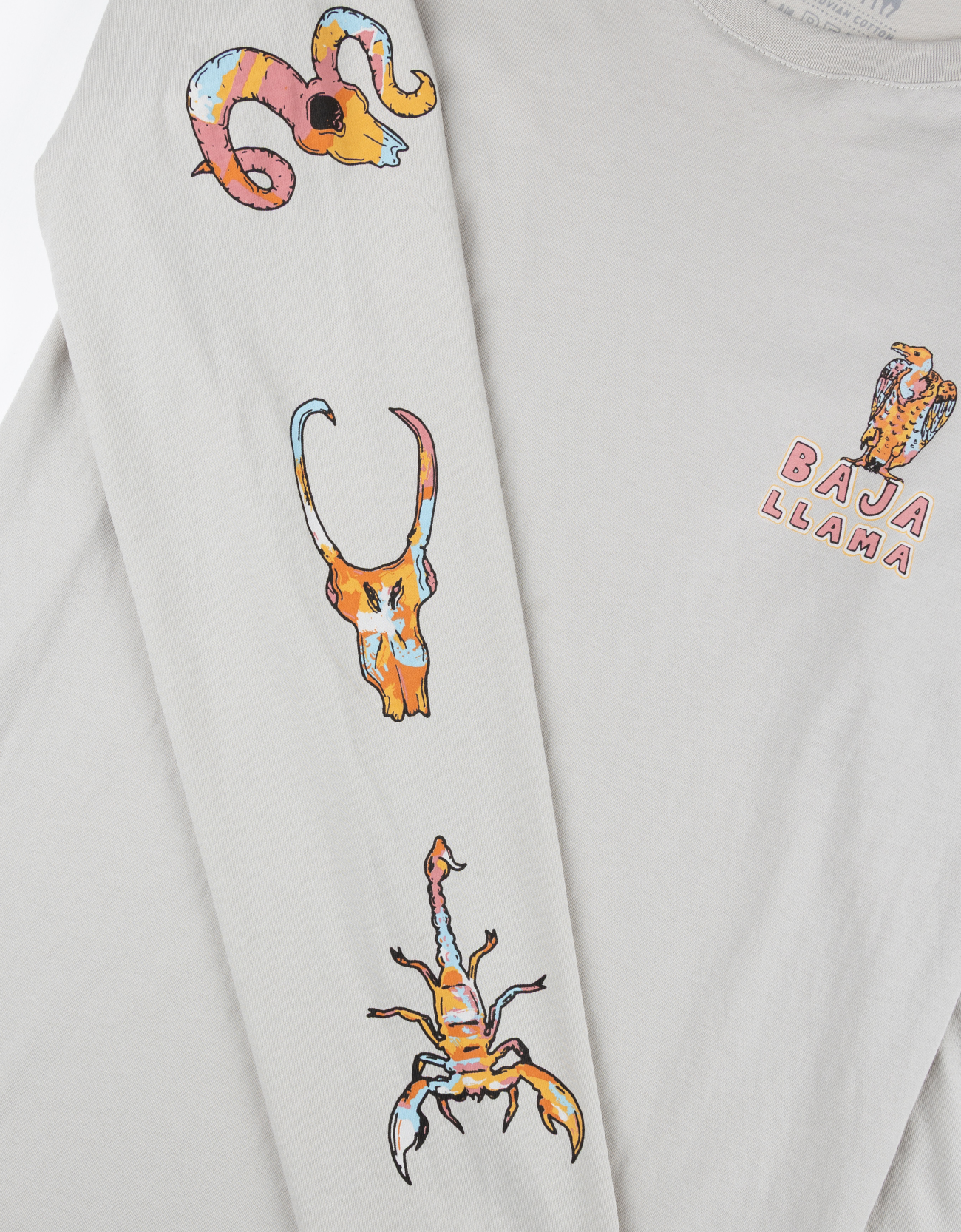 Baja Llama light desert-themed long sleeve tee with snake and Joshua tree back graphic. Soft cotton with printed sleeve details.