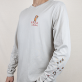 Baja Llama light desert-themed long sleeve tee with snake and Joshua tree back graphic. Soft cotton with printed sleeve details.