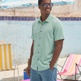 Clean modern travel shirt in solid color performance fabric