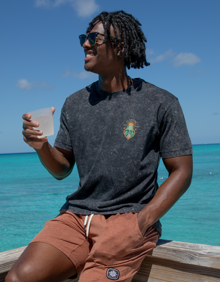 Front lifestyle view of Agave El Sativo black acid wash tee with small chest agave heart print