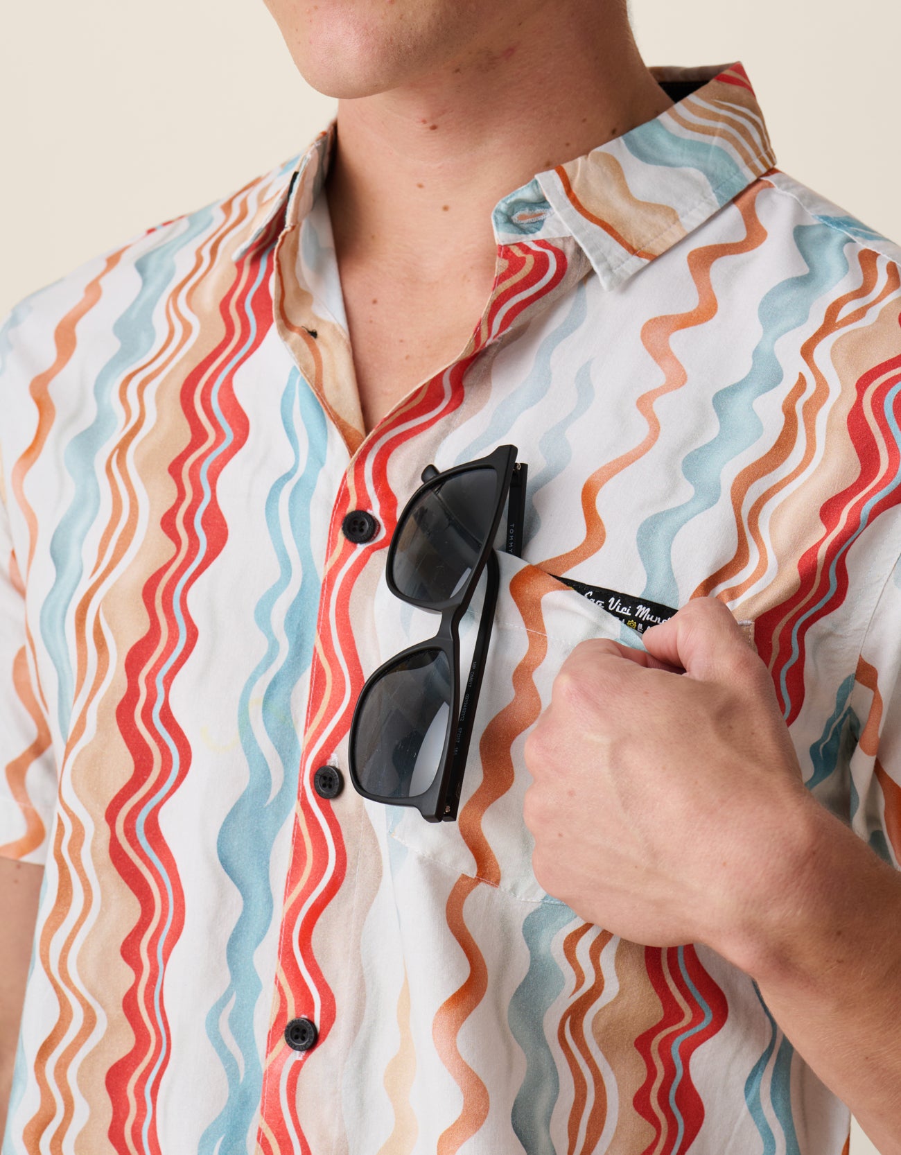 Men’s button up with sunglass holder chest label
