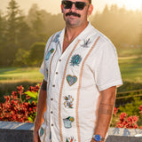 Model wearing Baja Llama El Sativo Tequila Guayabera button up shirt outdoors