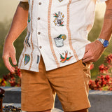 Men’s cream guayabera shirt with tequila-inspired embroidery and coconut buttons