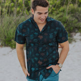 Black button up shirt with neon cactus print, side zipper pocket, branded buttons