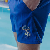 Blue mens volley shorts featuring a patterned print and embroidered jellyfish logo