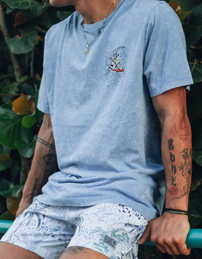 Model wearing the White Lobster acid wash Primo graphic tee from Baja Llama in a lifestyle setting.