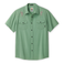 Green shirt with embroidered cactus designs on a white background