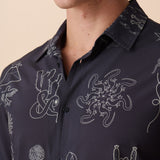 Close-up of Desert Martians print – line-art featuring scorpions, suns, pyramids, and cosmic creatures on an ultralight shirt