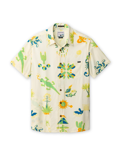 Front view of the DESERT MARTIANS - NIGHTHAWK™ RELAXED FIT BUTTON UP from Baja Llama, a light-colored, short-sleeve shirt featuring an all-over, hand-drawn print of desert icons, martians, and cacti.