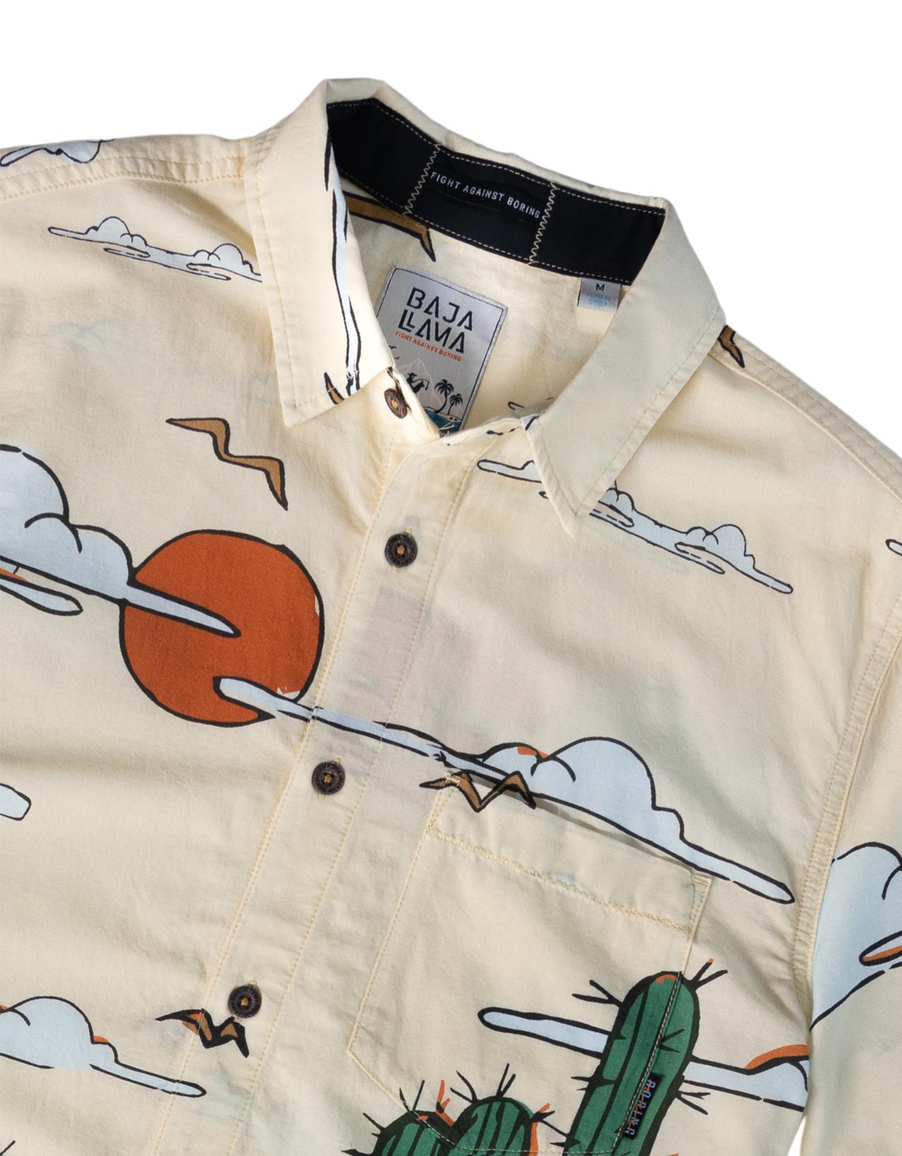 Cream short sleeve button up shirt featuring desert landscape and cactus print