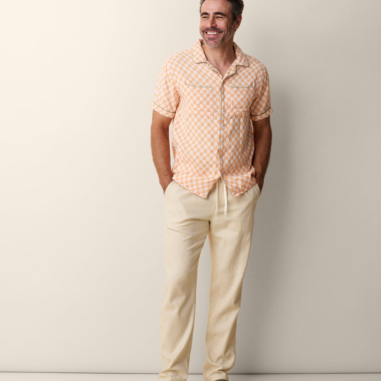 Men’s orange checker camp collar shirt with contrast green trim