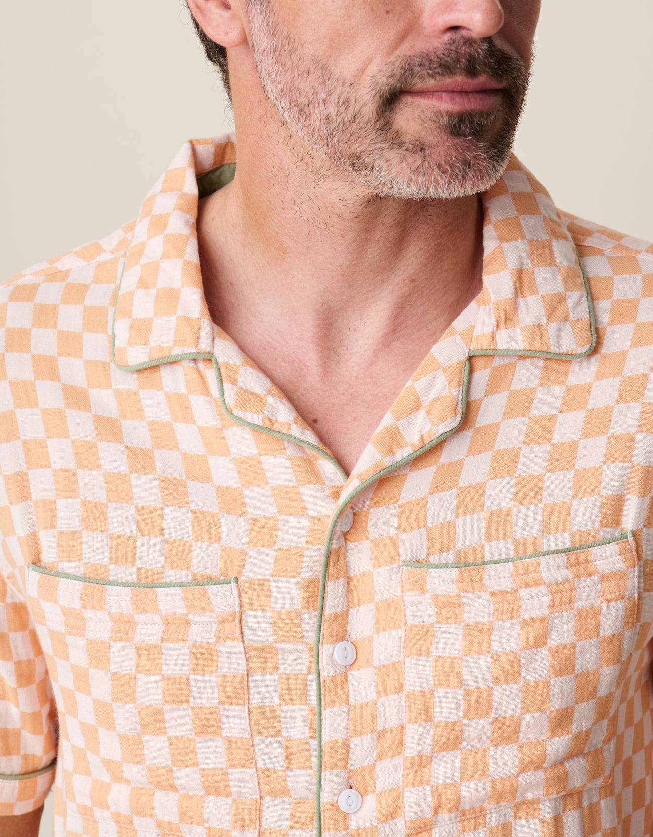Men’s lightweight checker print camp collar shirt with green piping details