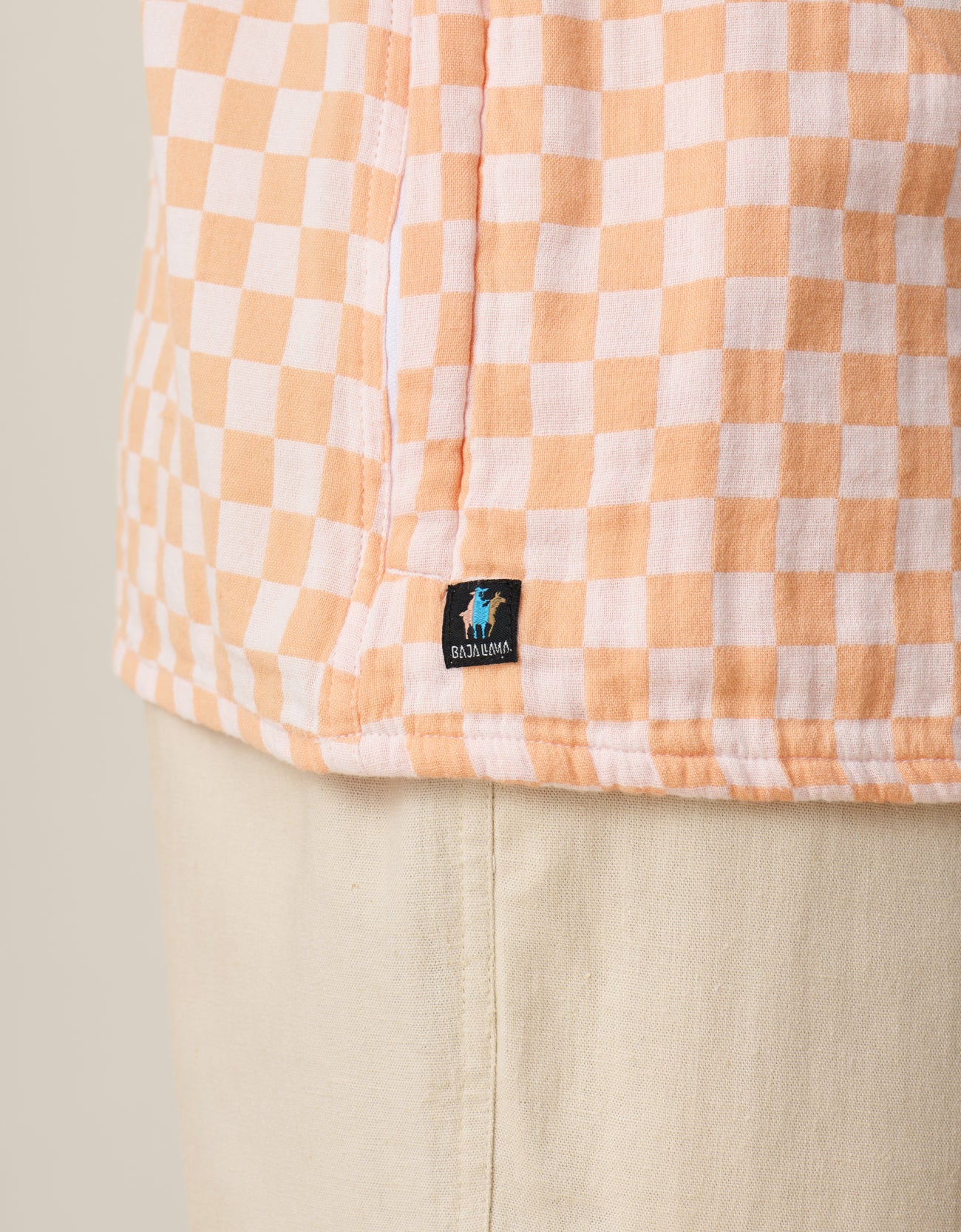 Limited-edition orange checker button-up shirt by Baja Llama