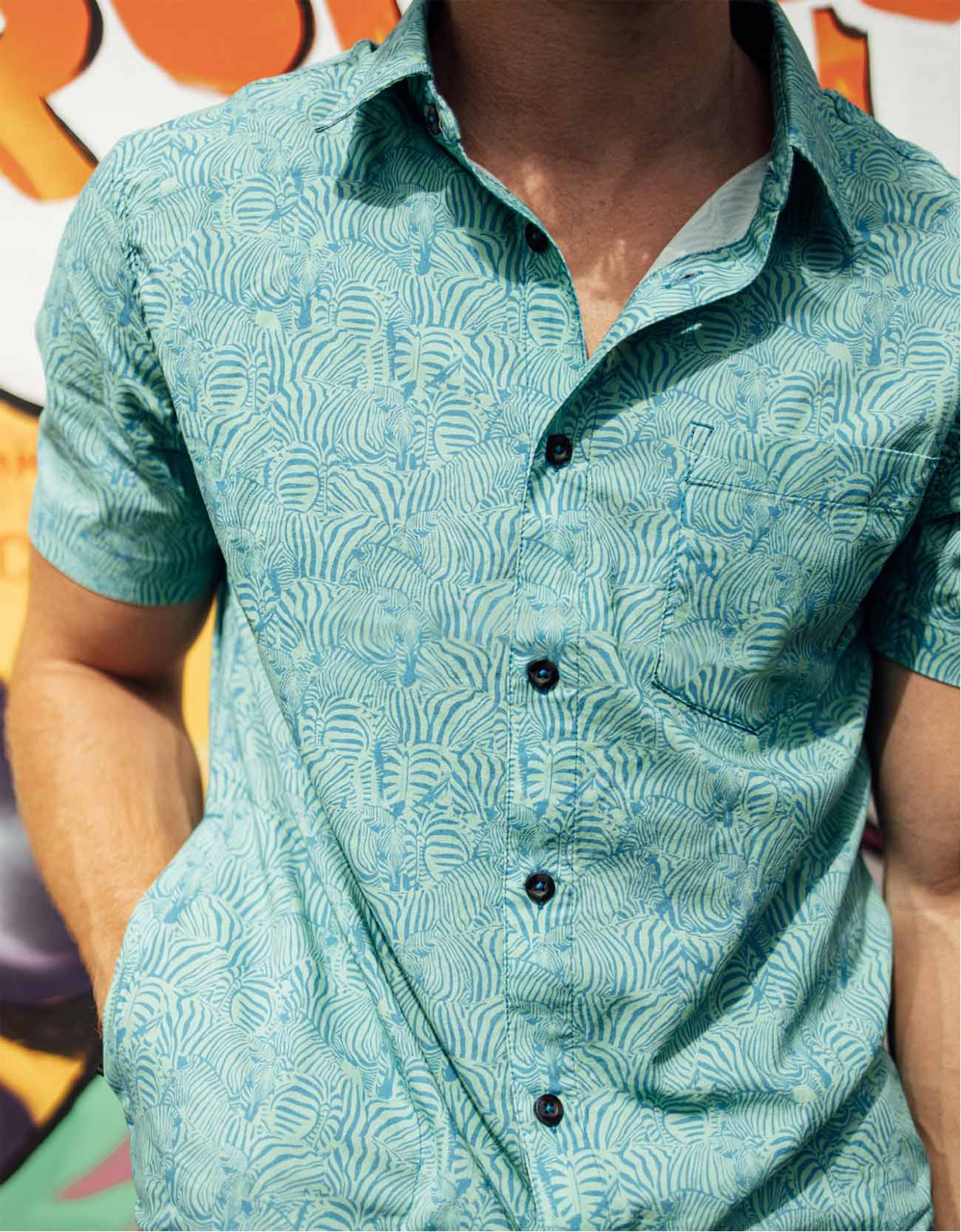 Green and turquoise button up with subtle zebra stripe print and side pocket