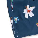 Navy floral swim shorts with a bold hibiscus print and white waistband. Lightweight, quick-dry fabric for a comfortable beach-ready look.