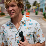 Smiling man wearing Baja Llama La Republica Bananera Icy Mint 7-Seas Relaxed Fit Button Up shirt outdoors