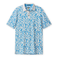 Front flat-lay view of the Baja Llama Leaf Me Blue Swingers Performance Polo, featuring an all-over vibrant blue and white tropical leaf pattern with a solid white collar and button placket.