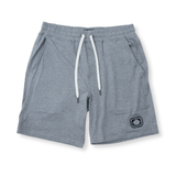Front view of the Baja Llama Mach Zero Lounge Shorts in gray, featuring an elastic waistband with a white drawstring and a branded patch.