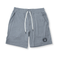 Front view of the Baja Llama Mach Zero Lounge Shorts in gray, featuring an elastic waistband with a white drawstring and a branded patch.