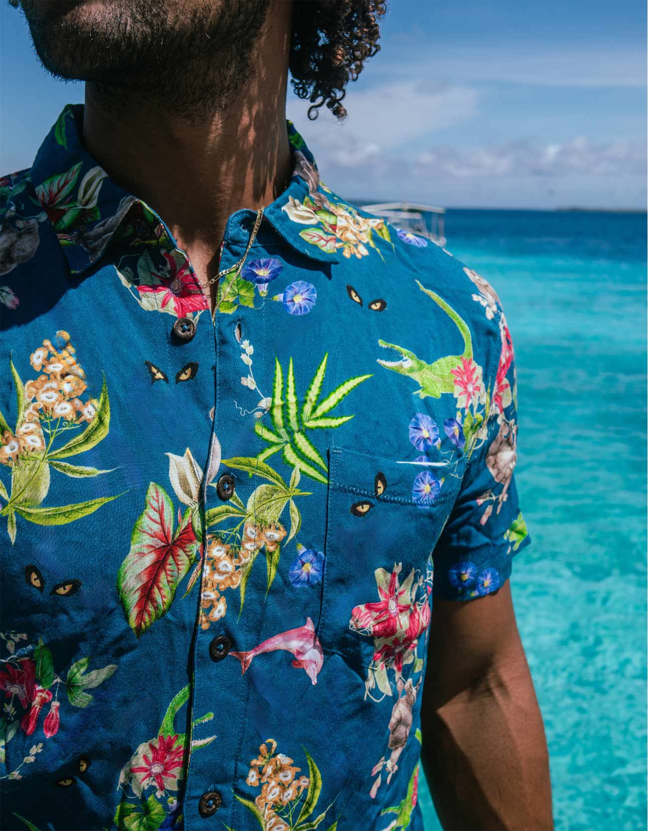 Navy button up with hand drawn pink dolphins, jungle animals and flowers print.