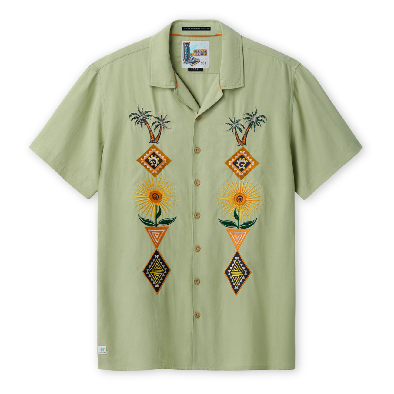 Front view of the Baja Llama 'Oasis Geometry' One-Off relaxed-fit short-sleeve button-up shirt in a soft sage green, featuring two vertical panels of symmetrical, colorful embroidery depicting palm trees, suns, and geometric diamond shapes.