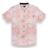 Peach colored button up shirt with tropical palm leaves print 