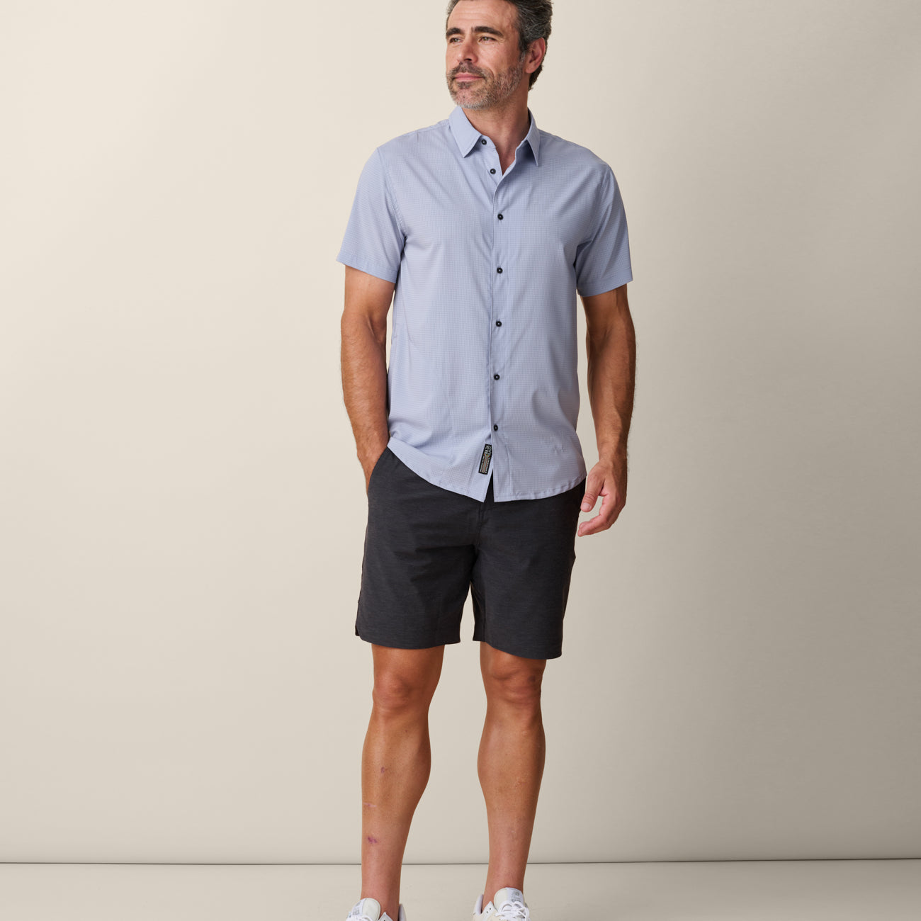 Model wearing solid color purple Mojave shirt – breathable performance fit
