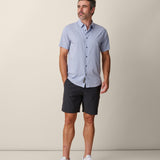 Model wearing solid color purple Mojave shirt – breathable performance fit
