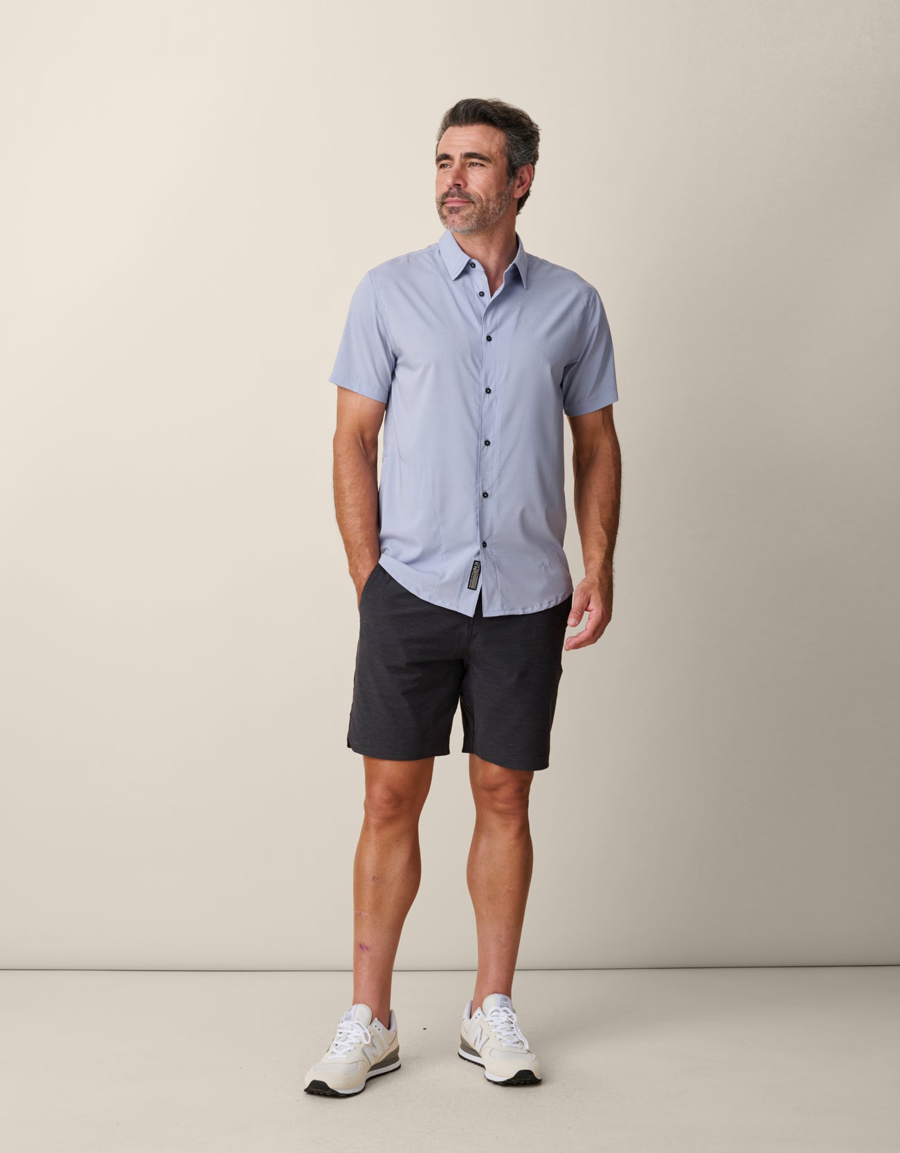 Model wearing solid color purple Mojave shirt – breathable performance fit
