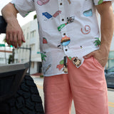Close-up of Baja Llama The BBQ Shirt 7-Seas Relaxed Fit Button Up showing white fabric with colorful barbecue print.